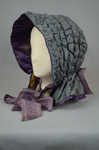 Hood, steel blue quilted silk, c. 1840s, side-front view by Irma G. Bowen Historic Clothing Collection