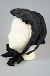 Bonnet, black silk, possibly for mourning, c. 1860s, side view by Irma G. Bowen Historic Clothing Collection