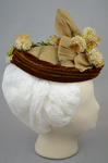 Toque, oval shape with cream ribbon, brown velvet, and artificial flowers, 1890s, side view by Irma G. Bowen Historic Clothing Collection