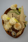 Toque, oval shape with cream ribbon, brown velvet, and artificial flowers, 1890s, top view by Irma G. Bowen Historic Clothing Collection