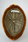 Toque, oval shape with cream ribbon, brown velvet, and artificial flowers, 1890s, interior view by Irma G. Bowen Historic Clothing Collection