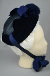 Bonnet, blue straw capote with velvet trim and feather puffs, 1870s-1880s, right side view by Irma G. Bowen Historic Clothing Collection