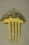 Comb, yellow with brass, late 19th century, front view by Irma G. Bowen Historic Clothing Collection