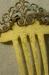 Comb, yellow with brass, late 19th century, detail of crystallization by Irma G. Bowen Historic Clothing Collection