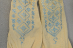 Stockings, cream cotton with blue embroidery, 1880s, back and front embroidery comparison