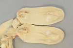 Stockings, cream cotton with red embroidered clocks, 1840s-1850s, detail of darning by Irma G. Bowen Historic Clothing Collection