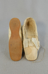 Shoes, white satin evening slippers, 1860-1870, top and sole view by Irma G. Bowen Historic Clothing Collection