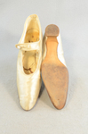 Shoes, white satin with strap, 1920s, top and sole view by Irma G. Bowen Historic Clothing Collection