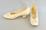 Shoes, white kidskin slippers with kidskin bow, 1879, side and front view by Irma G. Bowen Historic Clothing Collection