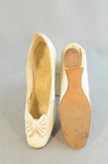 Shoes, white kidskin slippers with kidskin bow, 1879, top and sole view by Irma G. Bowen Historic Clothing Collection