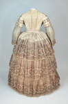 Dress, fan-front bodice and tiered skirt, of printed barege, 1850s, back view by Irma G. Bowen Historic Clothing Collection