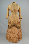 Dress, amber silk taffeta with chenille-fringed barege overdress, c. 1880, front view by Irma G. Bowen Historic Clothing Collection