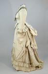 Dress, light gray silk faille with steel blue trim, 1870s, side view by Irma G. Bowen Historic Clothing Collection