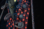 Dress, blue velvet and blue voided velvet on a red ground, c. 1892, detail of closure by Irma G. Bowen Historic Clothing Collection