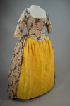 Quilted petticoat, yellow silk, 18th century, petticoat with dress, front view by Irma G. Bowen Historic Clothing Collection