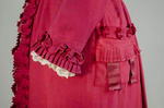 Housedress, cranberry red wool with self-trims, 1880s, detail of cuff and pocket by Irma G. Bowen Historic Clothing Collection