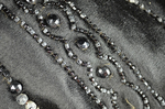 Cape, black silk satin with black bead embroidery, 1880s, close detail of embroidery by Irma G. Bowen Historic Clothing Collection