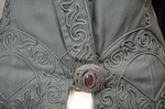 Coat, teal wool with cordwork, 1910-1915, detail of button by Irma G. Bowen Historic Clothing Collection