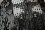 Mourning dress, striped black silk with black embroidered appliqués, c. 1900, detail of coils and buttons by Irma G. Bowen Historic Clothing Collection
