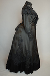 Mourning dress, striped black silk with black embroidered appliqués, c. 1900, side view
