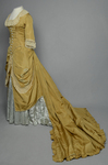 Dress, deep yellow silk taffeta with blue silk satin pleats and long train,1877-1882 , quarter view with restored seams and darts by Irma G. Bowen Historic Clothing Collection