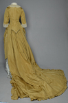 Dress, deep yellow silk taffeta with blue silk satin pleats and long train,1877-1882, back view with restored seams and darts by Irma G. Bowen Historic Clothing Collection
