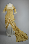 Dress, deep yellow silk taffeta with blue silk satin pleats and long train,1877-1882, front view with seams let out by Irma G. Bowen Historic Clothing Collection