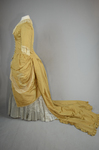 Dress, deep yellow silk taffeta with blue silk satin pleats and long train,1877-1882, side view with seams let out by Irma G. Bowen Historic Clothing Collection