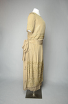 Dress, taupe silk crepe with short sleeves and overskirt embroidered with cord and gold beads, c. 1920, quarter view by Irma G. Bowen Historic Clothing Collection