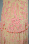 Sheath dress, sleeveless with irregular hem, apricot chiffon with pink and coral beads, c. 1925, detail of beading by Irma G. Bowen Historic Clothing Collection