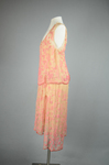 Sheath dress, sleeveless with irregular hem, apricot chiffon with pink and coral beads, c. 1925, side view by Irma G. Bowen Historic Clothing Collection