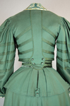 Suit, green wool with braid and velvet, c. 1906, detail of back