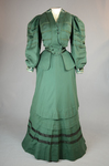 Suit, green wool with braid and velvet, c. 1906, front view