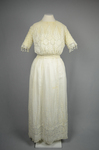 Dress, machine embroidered white muslin with a lace yoke and sleeves, c. 1905-1910, front view by Irma G. Bowen Historic Clothing Collection