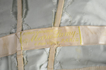 Evening gown, Marie Lamy of Paris, ice blue silk satin with a paillette-strewn net overlay, 1908-1915, detail of label by Irma G. Bowen Historic Clothing Collection