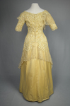 Evening gown, pale yellow faille with Chantilly lace and a bobbinet overlay appliquéd with Art Nouveau lilies, c. 1905, back view by Irma G. Bowen Historic Clothing Collection