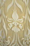 Evening gown, pale yellow faille with Chantilly lace and a bobbinet overlay appliquéd with Art Nouveau lilies, c. 1905, detail of appliqué by Irma G. Bowen Historic Clothing Collection