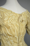 Evening gown, pale yellow faille with Chantilly lace and a bobbinet overlay appliquéd with Art Nouveau lilies, c. 1905, detail of back bodice by Irma G. Bowen Historic Clothing Collection