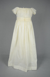 Infant’s dress, white on white checked batiste with an embroidered ribbon waist, c. 1897, back view