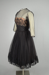 Cocktail dress, black point d’esprit with lace over black rayon lining, 1950s, side view by Irma G. Bowen Historic Clothing Collection