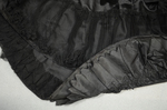 Evening gown, Marie Lamy of Paris, black silk satin with a black-sequined overlay and short puffed sleeves, 1890s, detail of train ruffles on lining and skirt