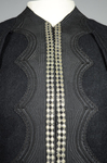 Jacket, black wool with large scalloped revers, pouched front, and topstitched silk trim, c. 1902, detail of front opening by Irma G. Bowen Historic Clothing Collection