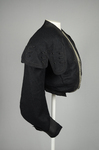 Jacket, black wool with large scalloped revers, pouched front, and topstitched silk trim, c. 1902, side view by Irma G. Bowen Historic Clothing Collection