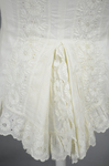 Shirtwaist, white embroidered cotton with ruffles flanking the buttoned front, 1884, detail of peplum by Irma G. Bowen Historic Clothing Collection
