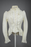 Shirtwaist, white embroidered cotton with ruffles flanking the buttoned front, 1884, front view by Irma G. Bowen Historic Clothing Collection