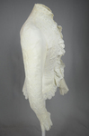 Shirtwaist, white embroidered cotton with ruffles flanking the buttoned front, 1884, side view