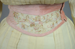 Dress, cream wool trimmed with lace, pink velvet, and multi-colored machine embroidery, 1908, detail of sash by Irma G. Bowen Historic Clothing Collection
