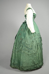 Dress, green damask silk with integral Swiss waist over a cotton blouse, 1860-1863, side view