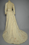 Dress, House of Rouff, cream wool with lace-draped bodice and sleeves, trimmed with cording, ribbon fronds, and roses, c. 1905, back view by Irma G. Bowen Historic Clothing Collection