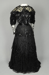 Evening gown, House of Rouff, black silk taffeta and satin with layered black net overlays embroidered with elongated black spangles and round sequins, c. 1905, front view